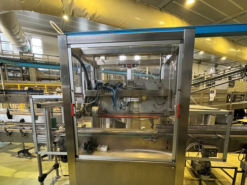 Discover the used Decimo XT70/1 handle applicator for PET bottles, with a speed of 70 ppm and pre-cut handle. Refurbished and Guaranteed. Discover it online.