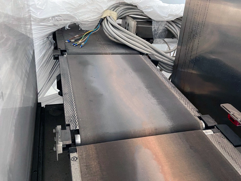 Macchina Packital per il controllo qualità e l’ispezione del peso nei processi di confezionamento industriale.